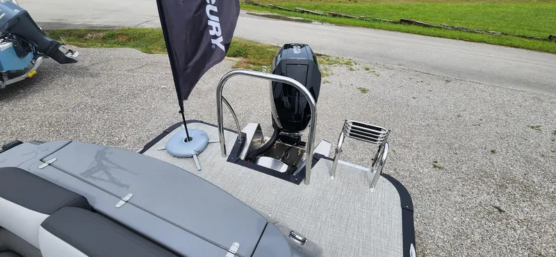 Slide: The Image of 2024 Avalon Windshield Catalina 2585 boat rear view with Mercury outboard motor. - 14