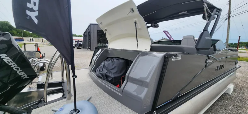 Slide: The Image of 2024 Avalon Windshield Catalina 2585 boat with Mercury engine, rear storage open. - 15
