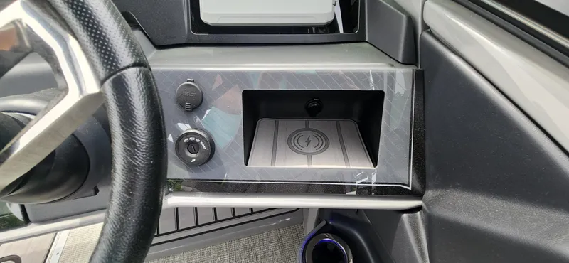 Slide: The Image of 2024 Avalon Windshield Catalina 2585 dashboard with wireless charging pad and controls. - 17