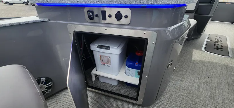 Slide: The Image of 2024 Avalon Windshield Catalina 2585 storage compartment with cooler and supplies. - 19