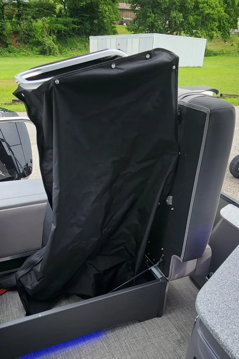 Slide: The Image of 2024 Avalon Windshield Catalina 2585 boat interior with black cover and seating. - 22