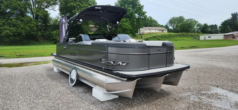 Slide: The Image of 2024 Avalon Windshield Catalina 2585 pontoon boat on gravel lot. - 4