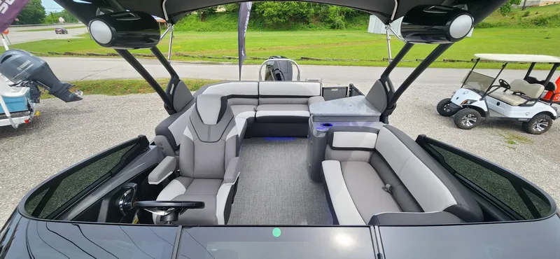Slide: The Image of 2024 Avalon Windshield Catalina 2585 boat interior with modern seating and steering console. - 7