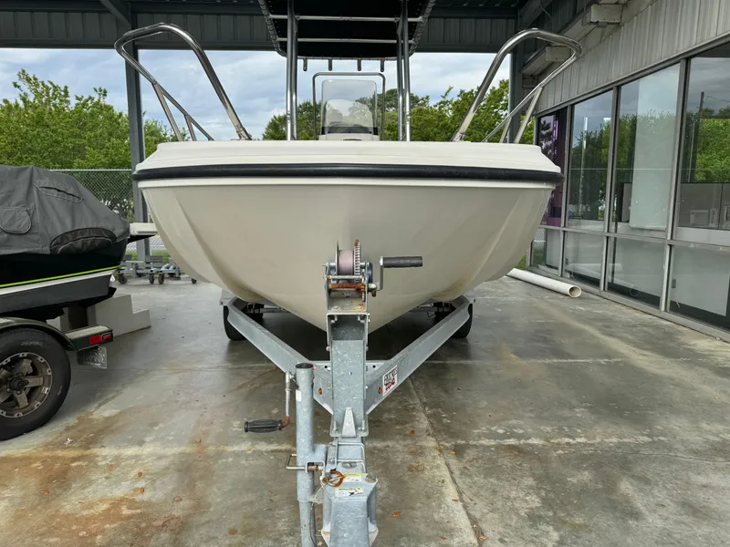 Slide: The Image of 2017 Bayliner Element F21 boat on a trailer in a covered storage area. - 1