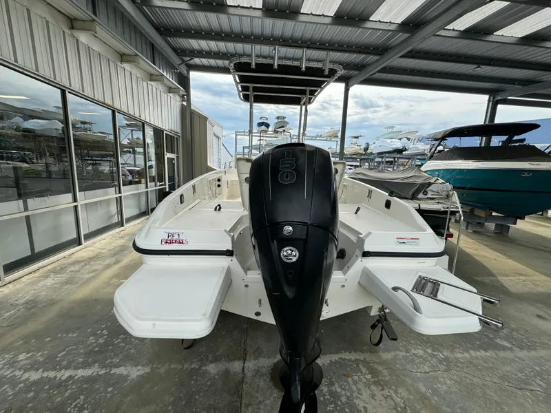 Slide: The Image of 2017 Bayliner Element F21 boat with outboard motor in covered marina. - 3