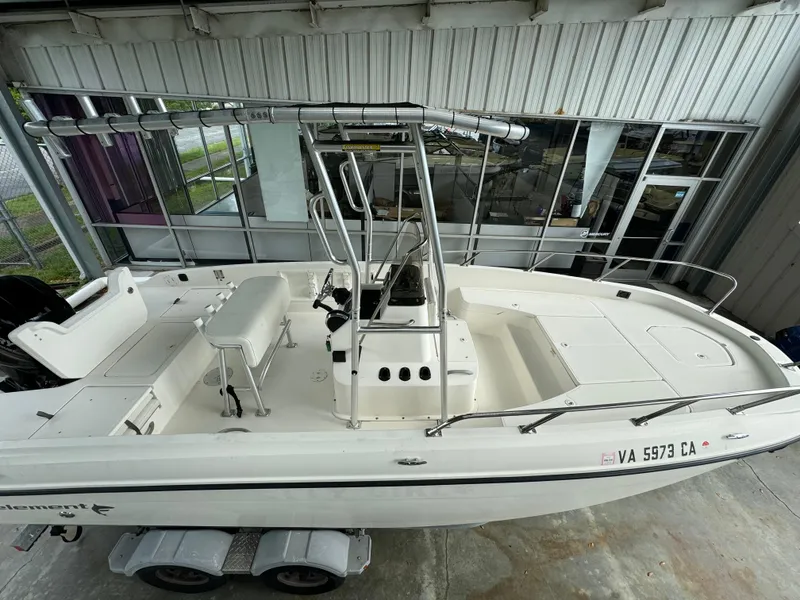 Slide: The Image of 2017 Bayliner Element F21 boat on trailer in covered storage. - 4