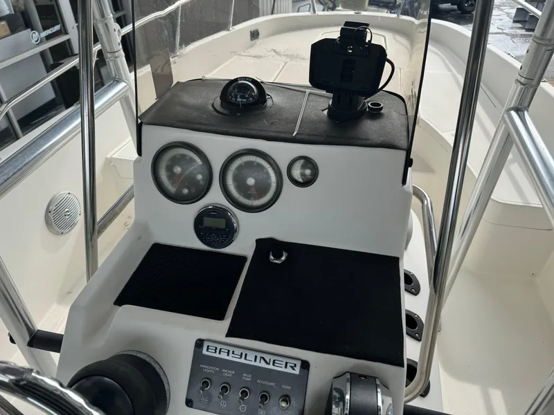 Slide: The Image of 2017 Bayliner Element F21 boat dashboard with gauges and controls. - 6