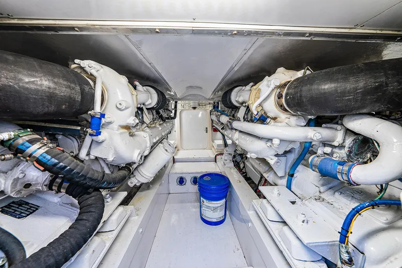 Slide: The Image of Engine room of a 1990 Monterey Custom Sportfish boat with dual engines. - 11