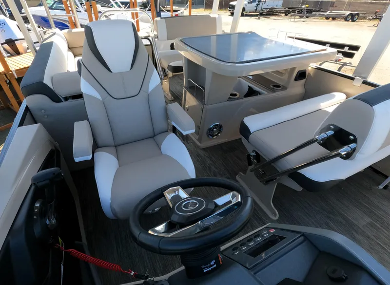 Slide: The Image of 2024 Avalon Catalina Entertainer Funship interior with steering wheel and seating area. - 11