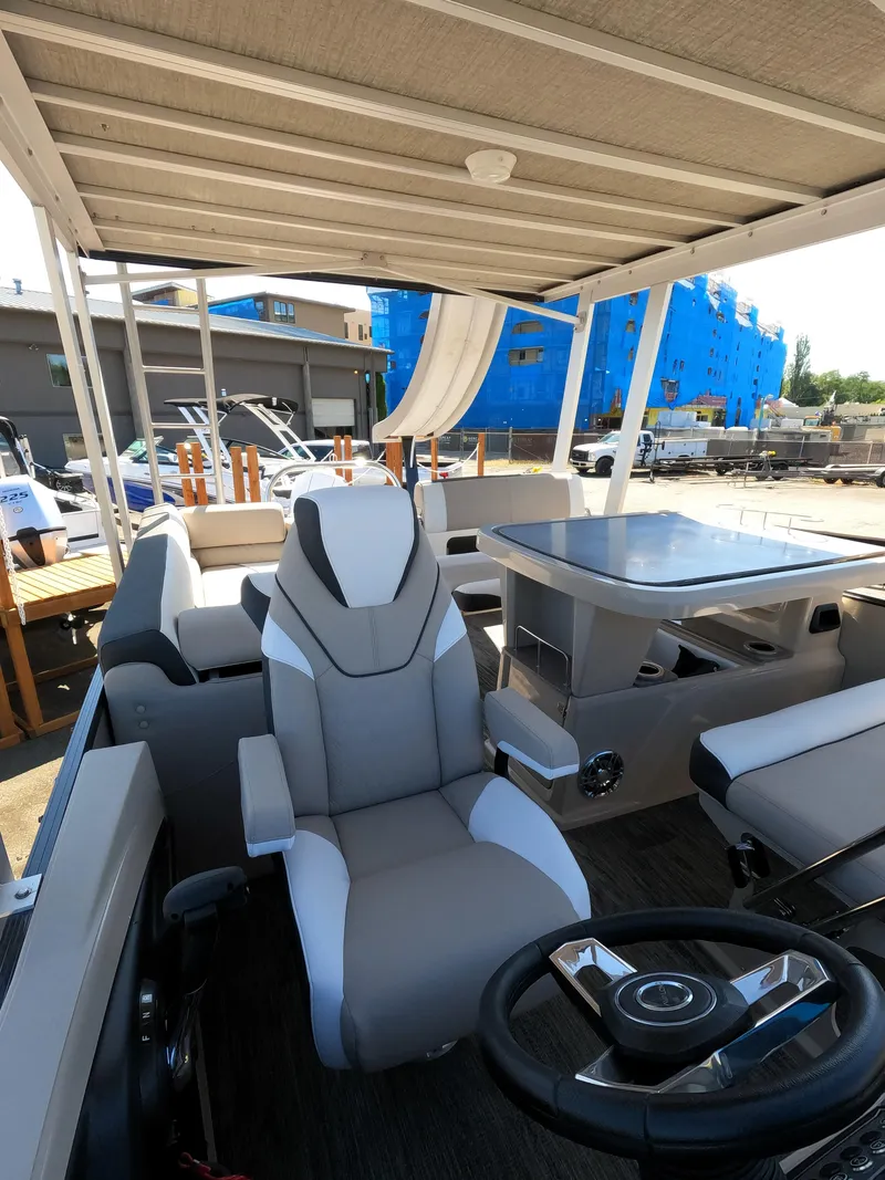 Slide: The Image of 2024 Avalon Catalina Entertainer Funship interior with captain's chair and slide. - 12