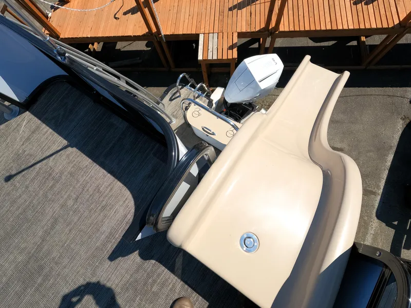 Slide: The Image of 2024 Avalon Catalina Entertainer Funship with slide and outboard motor. - 16