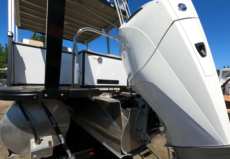 Slide: The Image of 2024 Avalon Catalina Entertainer Funship boat rear view with outboard motor. - 17