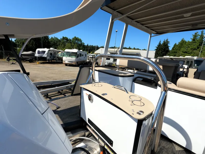 Slide: The Image of 2024 Avalon Catalina Entertainer Funship boat with outdoor seating and bar area. - 18