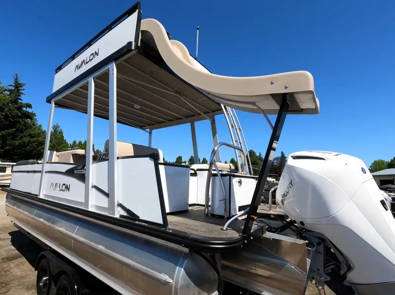 Slide: The Image of 2024 Avalon Catalina Entertainer Funship pontoon boat with slide and outboard motor. - 3