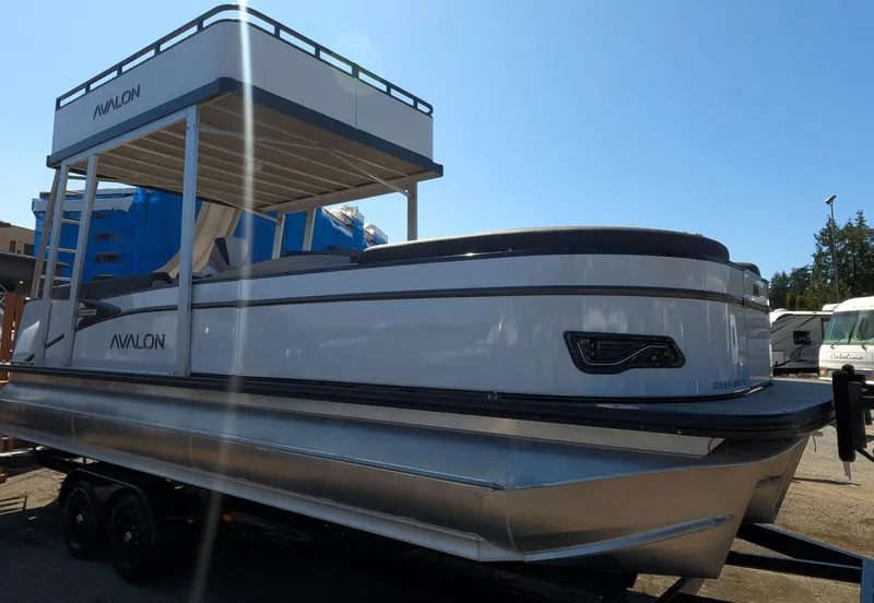Slide: The Image of 2024 Avalon Catalina Entertainer Funship pontoon boat on trailer, side view. - 4
