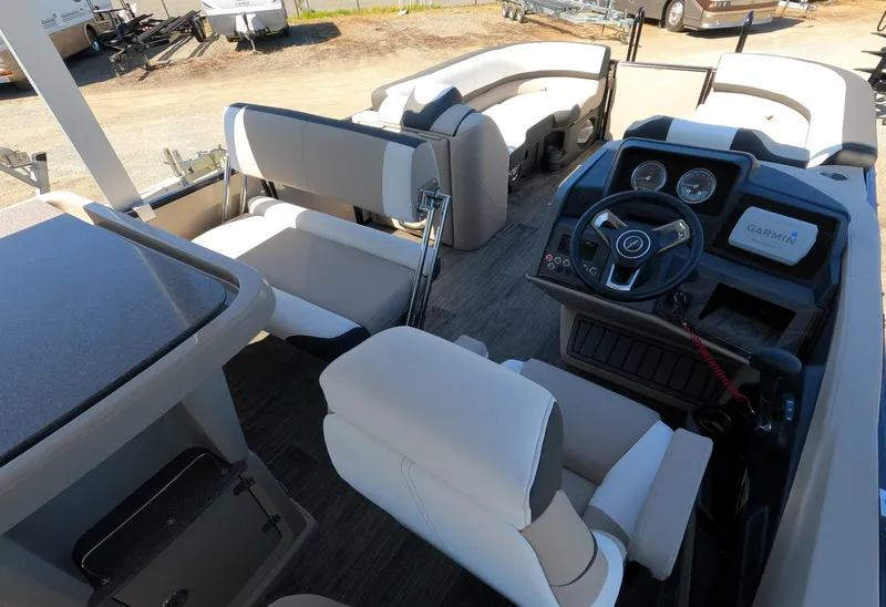 Slide: The Image of 2024 Avalon Catalina Entertainer Funship interior with helm, seating, and table. - 5