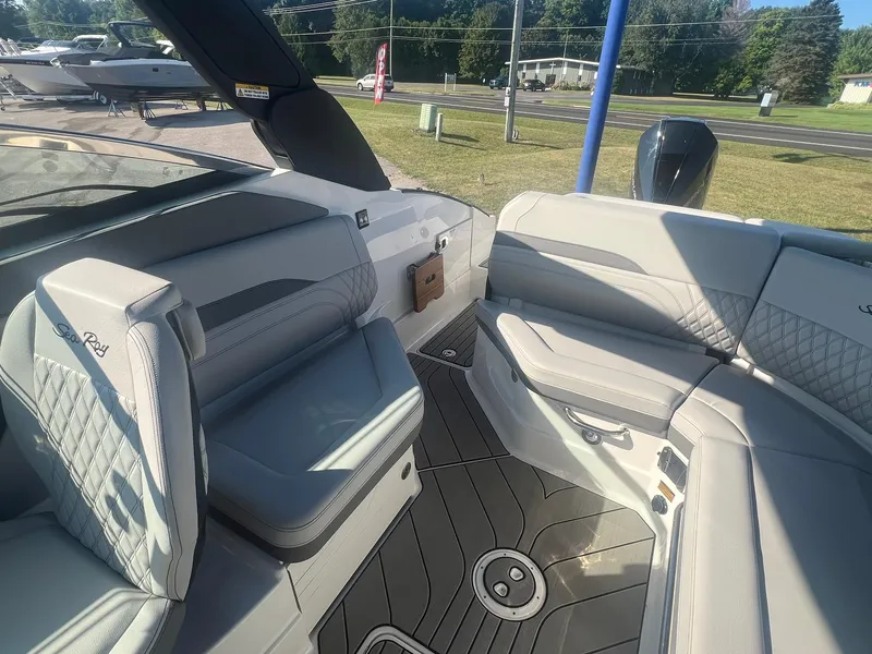 Slide: The Image of 2024 Sea Ray SLX 260 Outboard interior with luxurious seating and modern design. - 5
