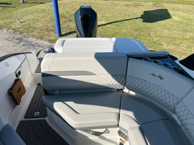 Slide: The Image of 2024 Sea Ray SLX 260 Outboard boat interior with luxurious seating and modern design. - 6