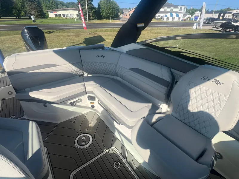 Slide: The Image of 2024 Sea Ray SLX 260 Outboard interior with luxurious seating and modern design. - 7