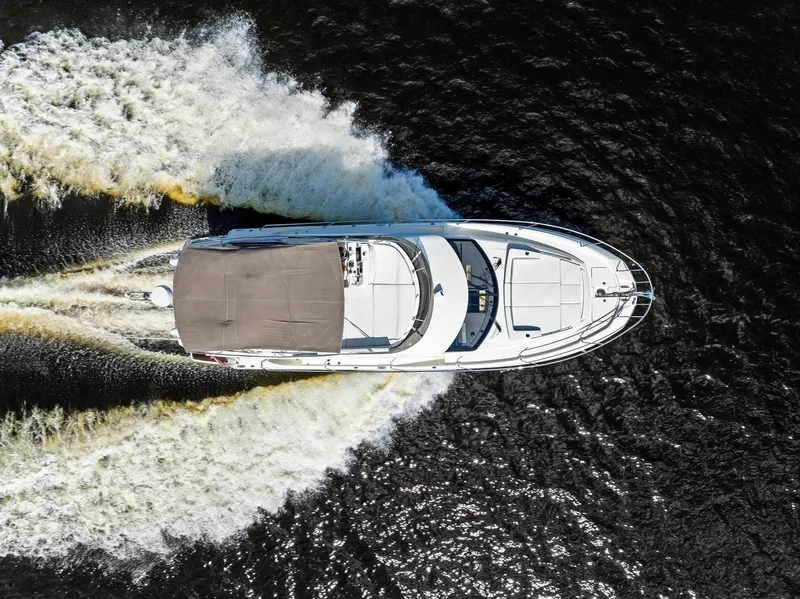 Slide: The Image of Aerial view of 2018 Prestige 460 yacht cruising on water. - 12