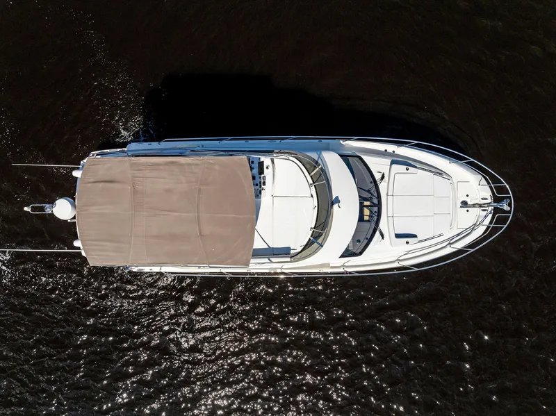 Slide: The Image of Aerial view of 2018 Prestige 460 yacht cruising on dark water. - 19