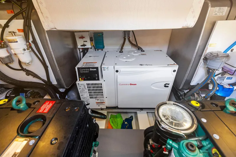 Slide: The Image of Engine room of a 2018 Prestige 460 yacht with Cummins Onan generator. - 25