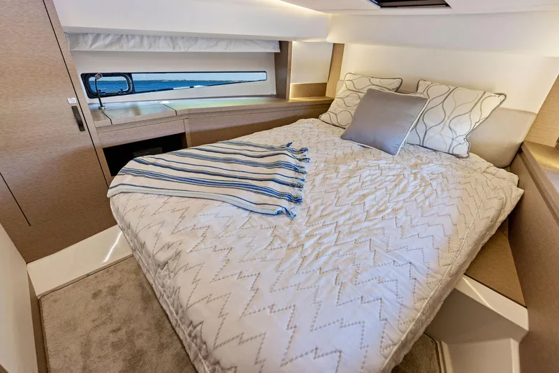 Slide: The Image of Luxurious bedroom in 2018 Prestige 460 yacht with cozy bedding and modern decor. - 28