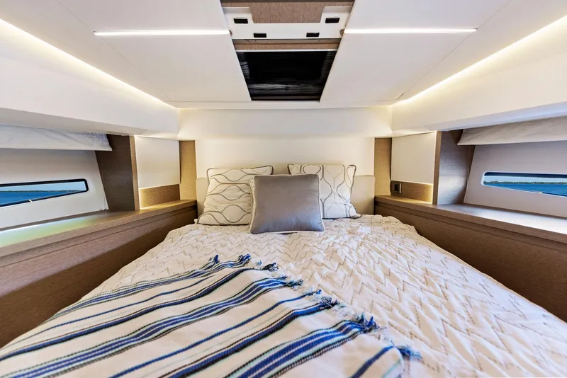 Slide: The Image of Luxurious bedroom interior of 2018 Prestige 460 yacht with cozy bedding and modern lighting. - 30