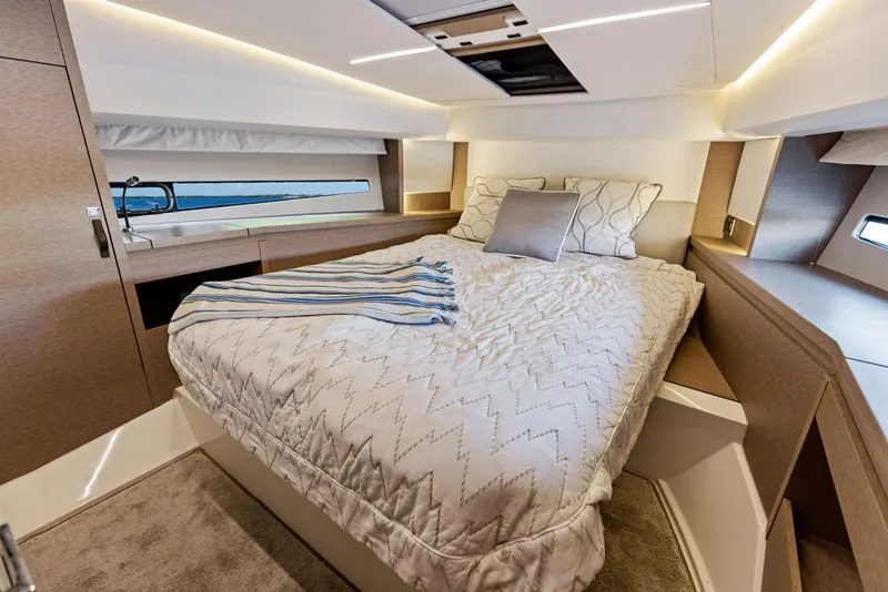 Slide: The Image of Luxurious bedroom interior of 2018 Prestige 460 yacht with cozy bedding and modern lighting. - 33