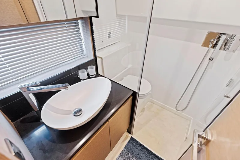 Slide: The Image of Modern bathroom in 2018 Prestige 460 yacht with sink and shower. - 34