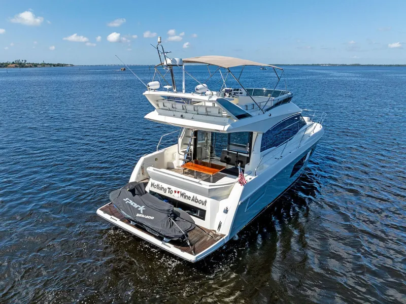 Slide: The Image of 2018 Prestige 460 yacht cruising on open water. - 4