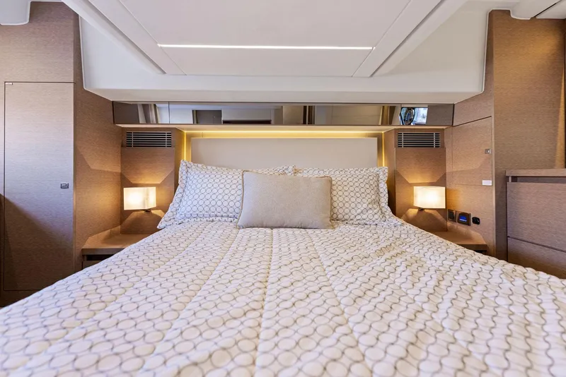 Slide: The Image of Luxurious bedroom interior of 2018 Prestige 460 yacht with modern bedding and ambient lighting. - 42