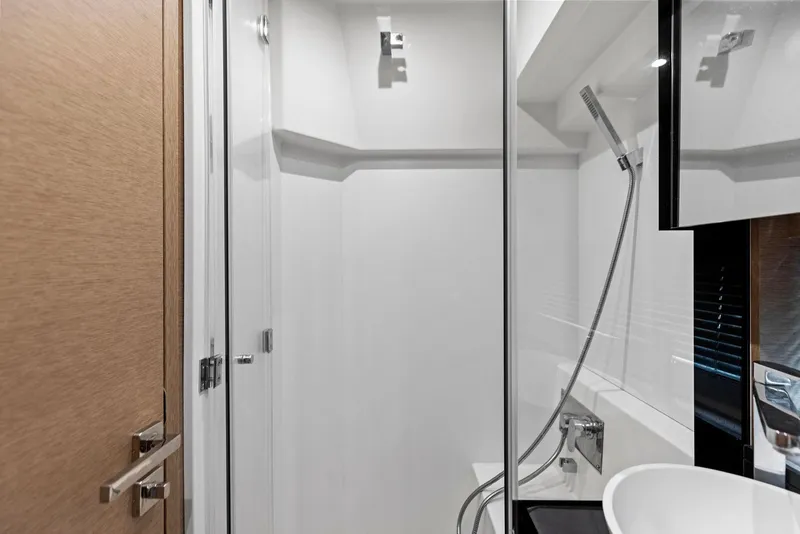 Slide: The Image of Modern bathroom in 2018 Prestige 460 yacht with glass shower and sleek fixtures. - 45