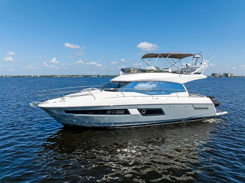 Slide: The Image of 2018 Prestige 460 yacht cruising on a sunny day. - 7