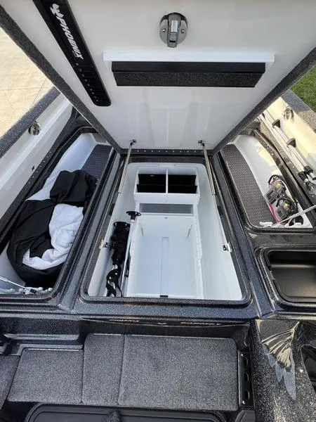 Slide: The Image of 2024 Phoenix 20 XE boat storage compartments and interior view. - 14