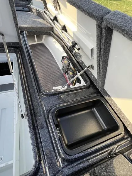 Slide: The Image of 2024 Phoenix 20 XE boat storage compartments and interior view. - 17