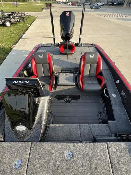 Slide: The Image of 2024 Phoenix 20 XE boat interior with Garmin electronics and dual seats. - 18
