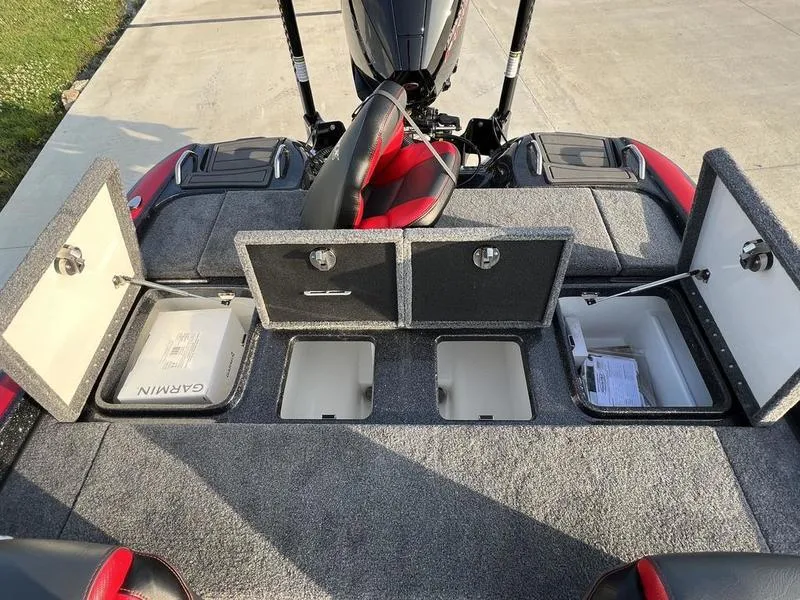 Slide: The Image of 2024 Phoenix 20 XE boat with open storage compartments and Garmin equipment. - 20