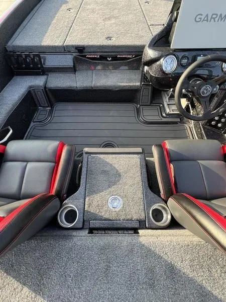 Slide: The Image of 2024 Phoenix 20 XE boat interior with dual seats and Garmin navigation system. - 22