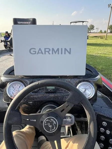 Slide: The Image of 2024 Phoenix 20 XE boat dashboard with Garmin navigation system. - 26