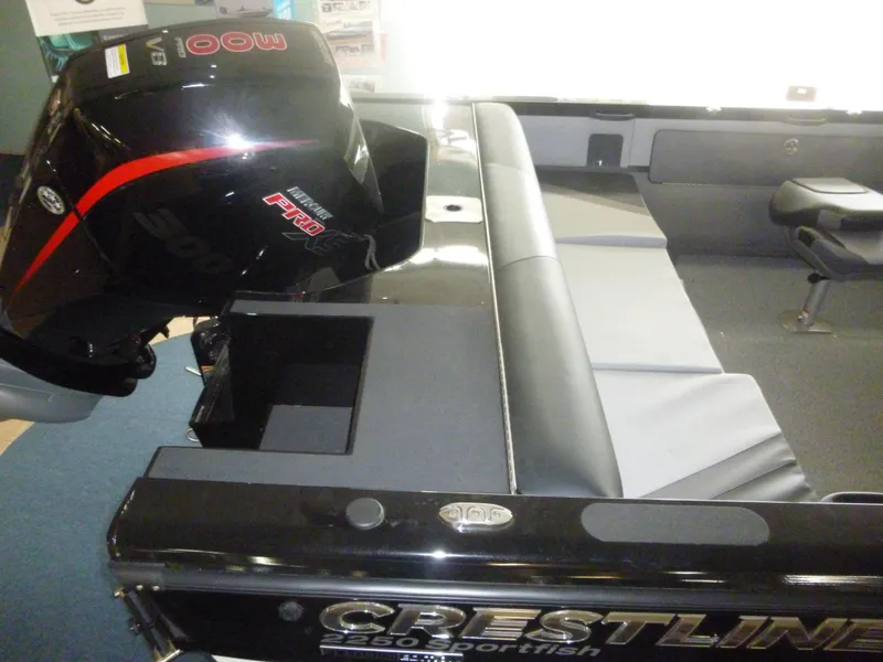 Slide: The Image of 2023 Crestliner 2250 Sportfish boat with a powerful outboard motor. - 3