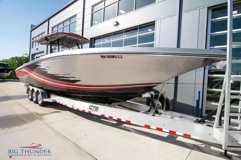 Slide: The Image of 2021 Fountain 38 SC boat on trailer at Big Thunder Marine dealership. - 1