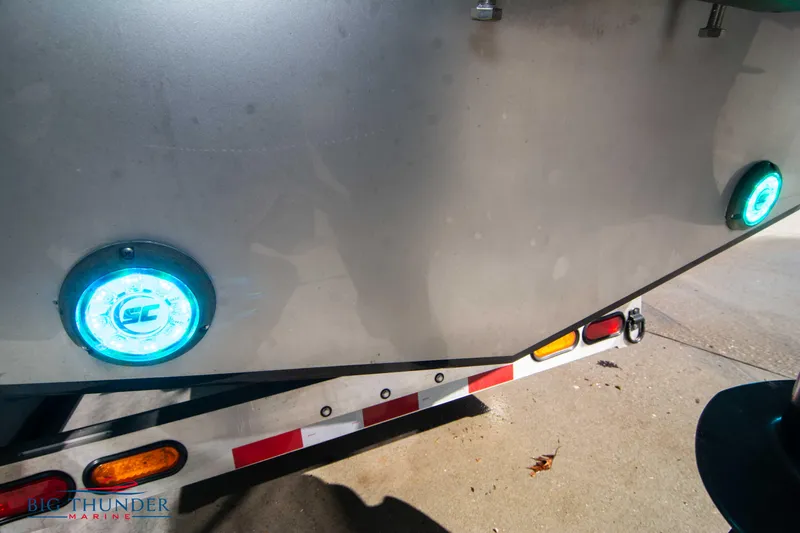 Slide: The Image of 2021 Fountain 38 SC boat on trailer with illuminated blue lights. - 11