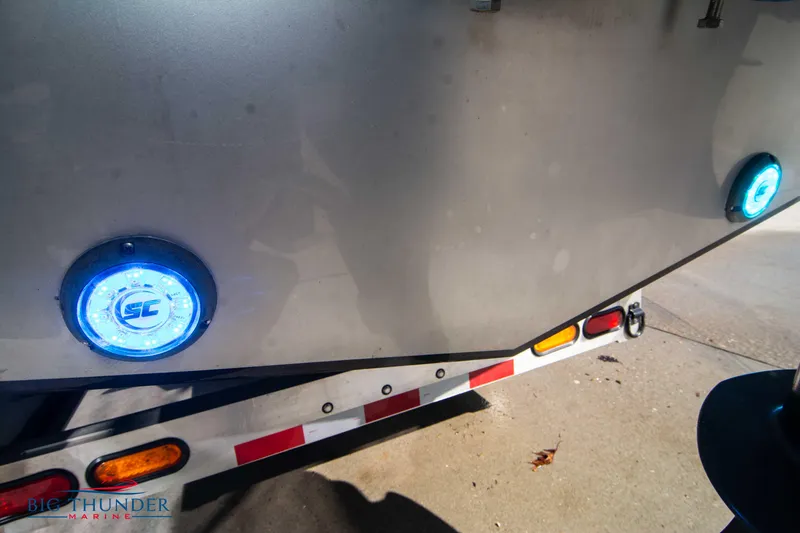 Slide: The Image of 2021 Fountain 38 SC boat on trailer with blue LED lights. - 12