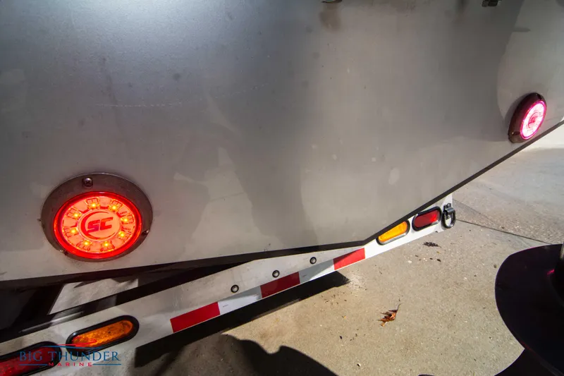 Slide: The Image of Close-up of 2021 Fountain 38 SC boat trailer with red and amber lights. - 14