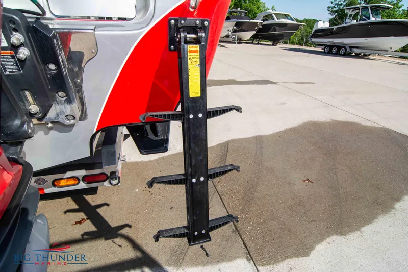 Slide: The Image of 2021 Fountain 38 SC boat with a foldable boarding ladder. - 15