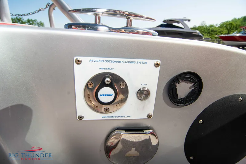 Slide: The Image of Close-up of a 2021 Fountain 38 SC Reverso Outboard Flushing System. - 18