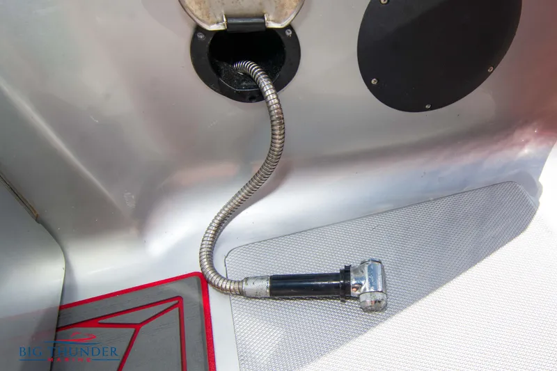 Slide: The Image of Built-in shower hose on a 2021 Fountain 38 SC boat. - 19
