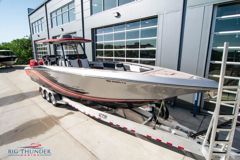 Slide: The Image of 2021 Fountain 38 SC boat on trailer at Big Thunder Marine dealership. - 2