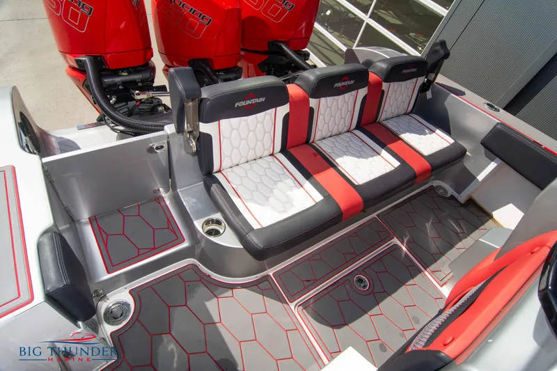 Slide: The Image of 2021 Fountain 38 SC boat interior with red and white seating and flooring. - 22